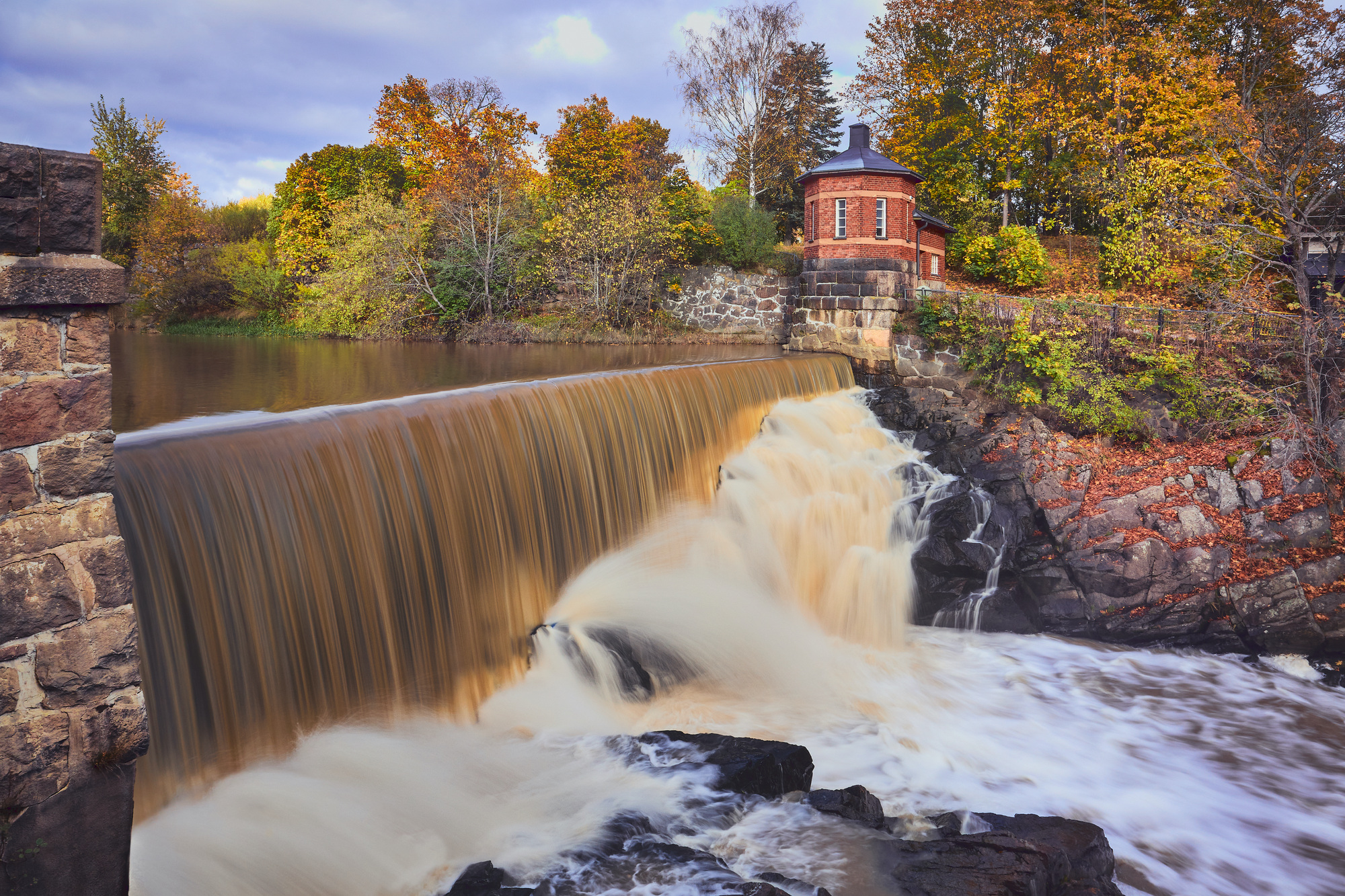 Waterfall near an old power plant in Europe.